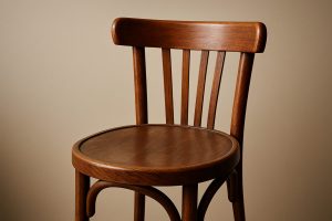 A close-up view of a wooden chair, highlighting its stylish design and craftsmanship.
